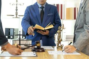 judge's gavel in law office is placed on table to symbolize judge deciding lawsuit. gavel wood on wooden table of lawyers in legal advice office as symbol of fair judgment in cases. photo