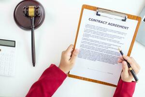 contract of sale was placed on the table in the lawyer office because the company hired the lawyer office as a legal advisor and drafted the contract so that the client could sign the right contract. photo