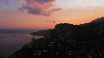 Koshka Mountain and Simeiz Town at Sunset. Crimea, Russia. Aerial View video