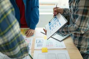 The designer team is designing the uxui system to make the uxui system work well on new phones and support system updates. Website development concept UI UX front end designer photo