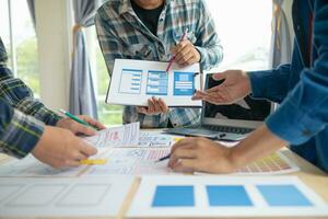 The designer team is designing the uxui system to make the uxui system work well on new phones and support system updates. Website development concept UI UX front end designer photo