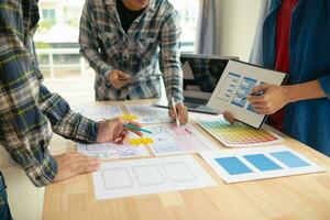 The designer team is designing the uxui system to make the uxui system work well on new phones and support system updates. Website development concept UI UX front end designer photo