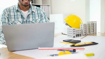 Construction engineers are checking blueprints and calculating their accuracy after receiving plans from architect in order start  construction safely. Inspection Concept from construction engineering photo