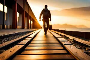 un hombre caminando en un ferrocarril pista a puesta de sol. generado por ai foto