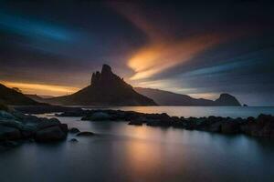 the sun sets over a mountain range and a rocky beach. AI-Generated photo