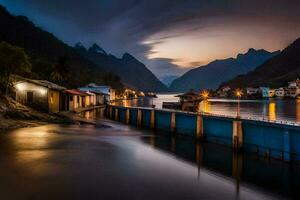 a river at night with houses and mountains in the background. AI-Generated photo