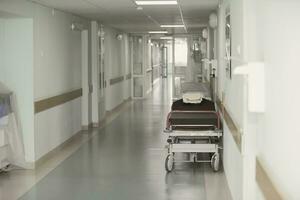 Empty hospital corridor with medical trolley.Hospital corridor photo