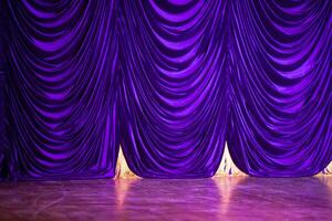 Theatrical purple curtain and stage. photo