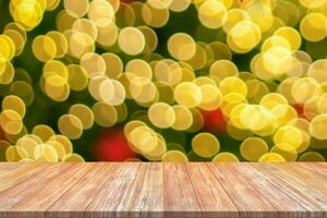 Empty wood table top with blur Christmas tree with bokeh light background photo