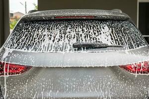 car cleaning and washing with foam soap photo