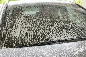 car cleaning and washing with foam soap photo