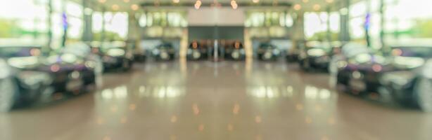 new cars in showroom interior blurred abstract background photo