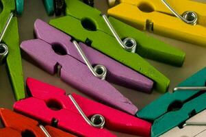 colorful clothes pegs are arranged in a row photo