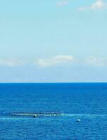 a large body of water with a small boat in it photo