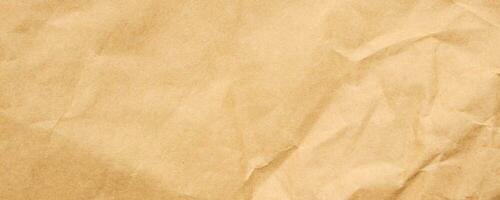 Abstract crumpled and creased recycle brown craft paper texture background photo
