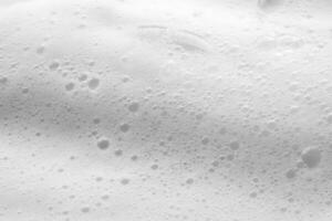 Abstract white soap foam bubbles texture background photo