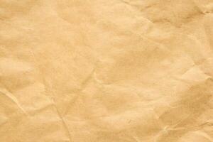 Abstract crumpled and creased recycle brown paper texture background photo
