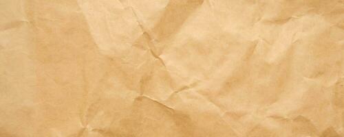 Abstract crumpled and creased recycle brown craft paper texture background photo