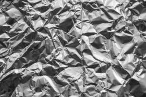 Shiny metal silver gray foil crumpled texture background photo