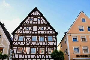 a row of buildings with a triangular roof photo