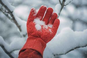 hand wearing red glove holding holding snow in the winter bokeh style background with Generative AI photo