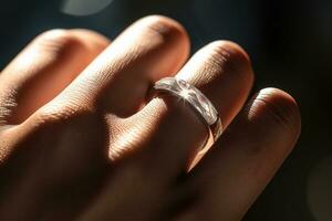 woman hand wearing a silver ring on dark background bokeh style background with Generative AI photo