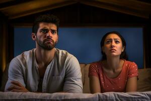 unhappy couple on bed with worried expression with Generative AI photo