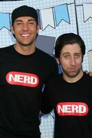 LOS ANGELES, SEP 26 - Zachary Levi, Simon Helberg arrives at the Ultimate Slam Paddle Jam 2010 at Music Box Theater on September 26, 2010 in Los Angeles, CA photo