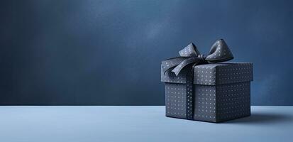 Elegant Small Luxury Blue Gift Box with Bow on Matching Table Background. AI Generated photo