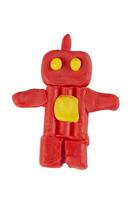 Red robot from plasticine on a white background. photo