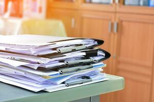 Stack of documents on table of secretary, sunlight edited, soft and selective focus. photo