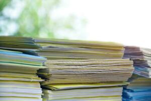 Stack of documents on table of secretary, sunlight edited, soft and selective focus. photo