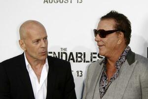 LOS ANGELES  AUGUST 3 Bruce Willis  Mickey Rourke arrives at The Expendables LA Premiere at Graumans Chinese Theater on August 3 2010 in Los Angeles CA photo