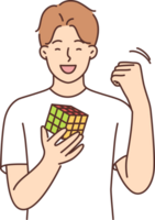 Happy teenager boy gathered rubik cube and rejoice in solving puzzle and makes victory gesture png