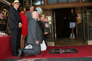 LOS ANGELES  AUGUST 5 Maggie Gyllenhaal Emma Thompson Hugh Laurie at the Hollywood Walk of Fame Ceremony for Emma Thompson at Hollywood Walk of Fame on August 5 2010 in Los Angeles CA photo