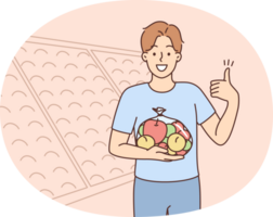 Smiling man with bag of apples in supermarket png