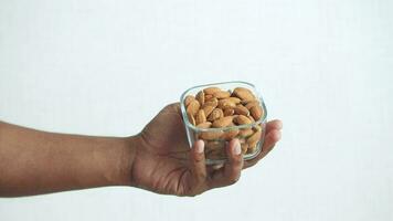 close up of almond nuts on man's hand video