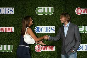 LOS ANGELES  JUL 28 Eva La Rue  Eric Christian Olsen arrives at the 2010 CBS The CW Showtime Summer Press Tour Party at The Tent Adjacent to Beverly Hilton Hotel on July28 2010 in Beverly Hills CA photo