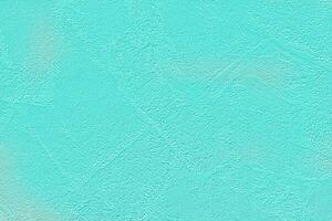 Bright paper embossed turquoise background. photo