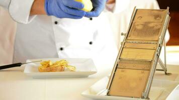 Professional chef hands cutting potatoes with knife and mandolin video