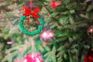 Christmas background with a beautiful Christmas toy and light beams from a garland. photo