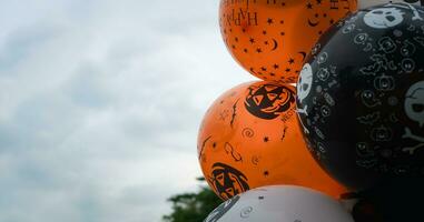 Black, white and orange balloons decoration for Halloween. photo