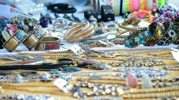 Taking bracelet jewelry exposed in hawker stall craft video