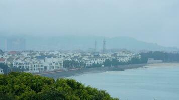 The old fishing village view with the traditional architectures on the south of the China along the ocean coast photo