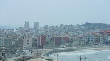 The old fishing village view with the traditional architectures on the south of the China along the ocean coast photo