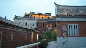 The old fishing village view with the traditional architectures on the south of the China along the ocean coast photo