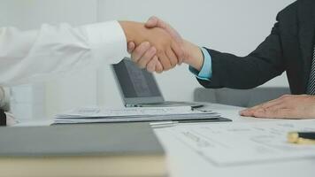 Hands of recruiter holding resume in front of candidate at desk video