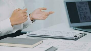 Hands of recruiter holding resume in front of candidate at desk video