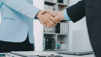 Hands of recruiter holding resume in front of candidate at desk video