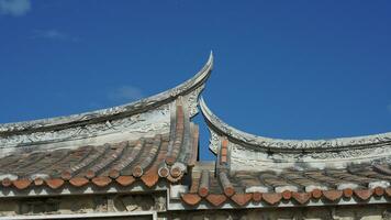 The old fishing village view with the traditional architectures on the south of the China along the ocean coast photo